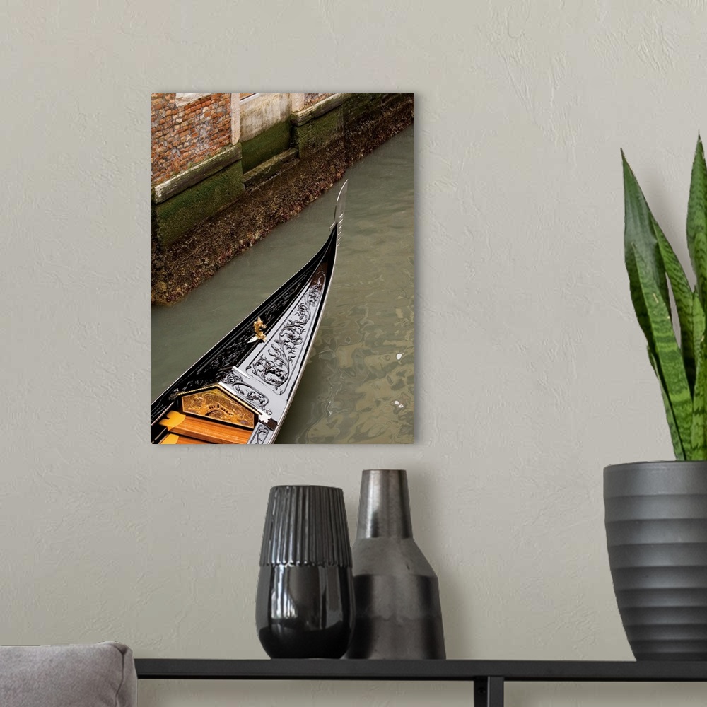A modern room featuring Vertical photograph of a gondola boat ride in Venice.