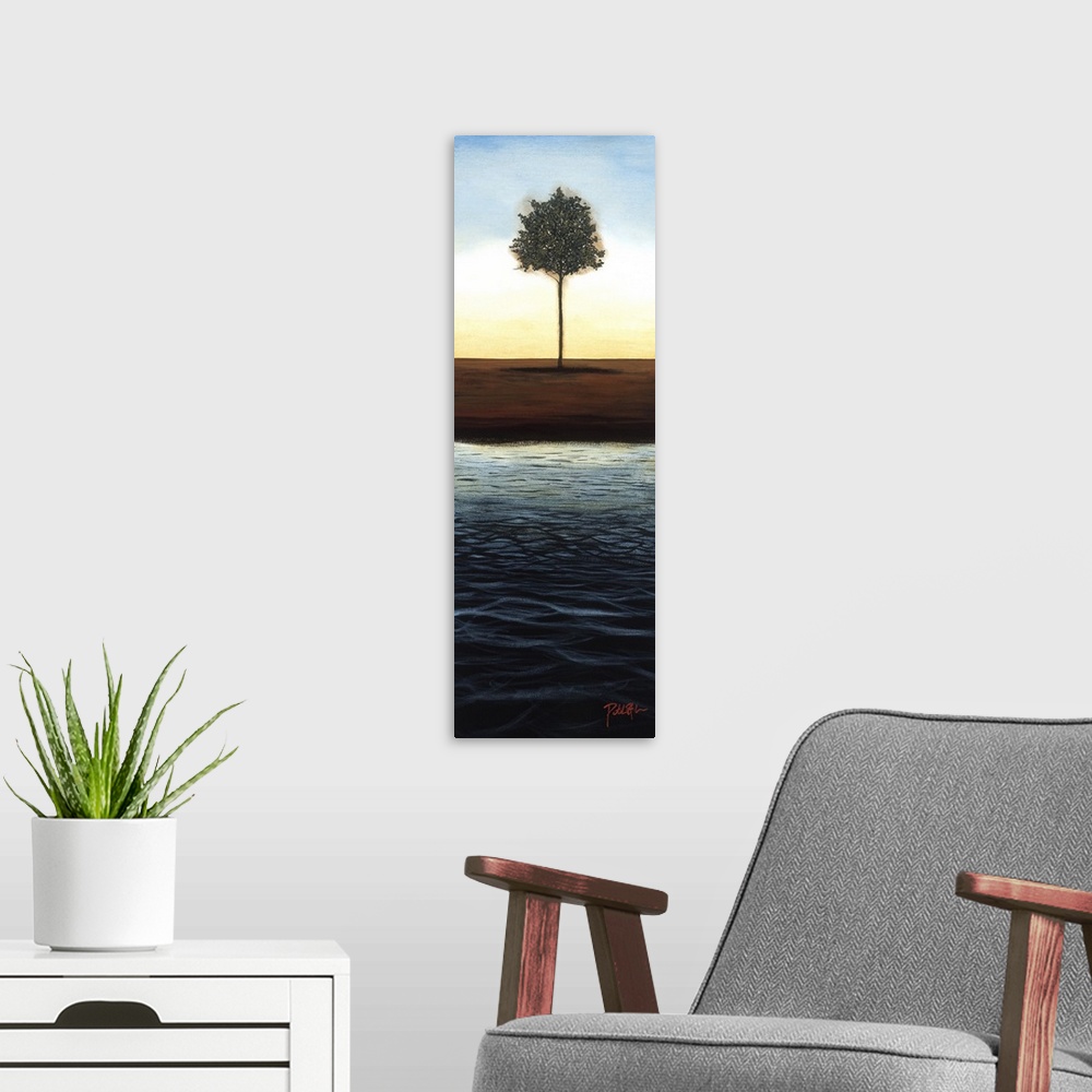 A modern room featuring A long vertical painting of a single tree next to a body of water with the sun setting behind it.
