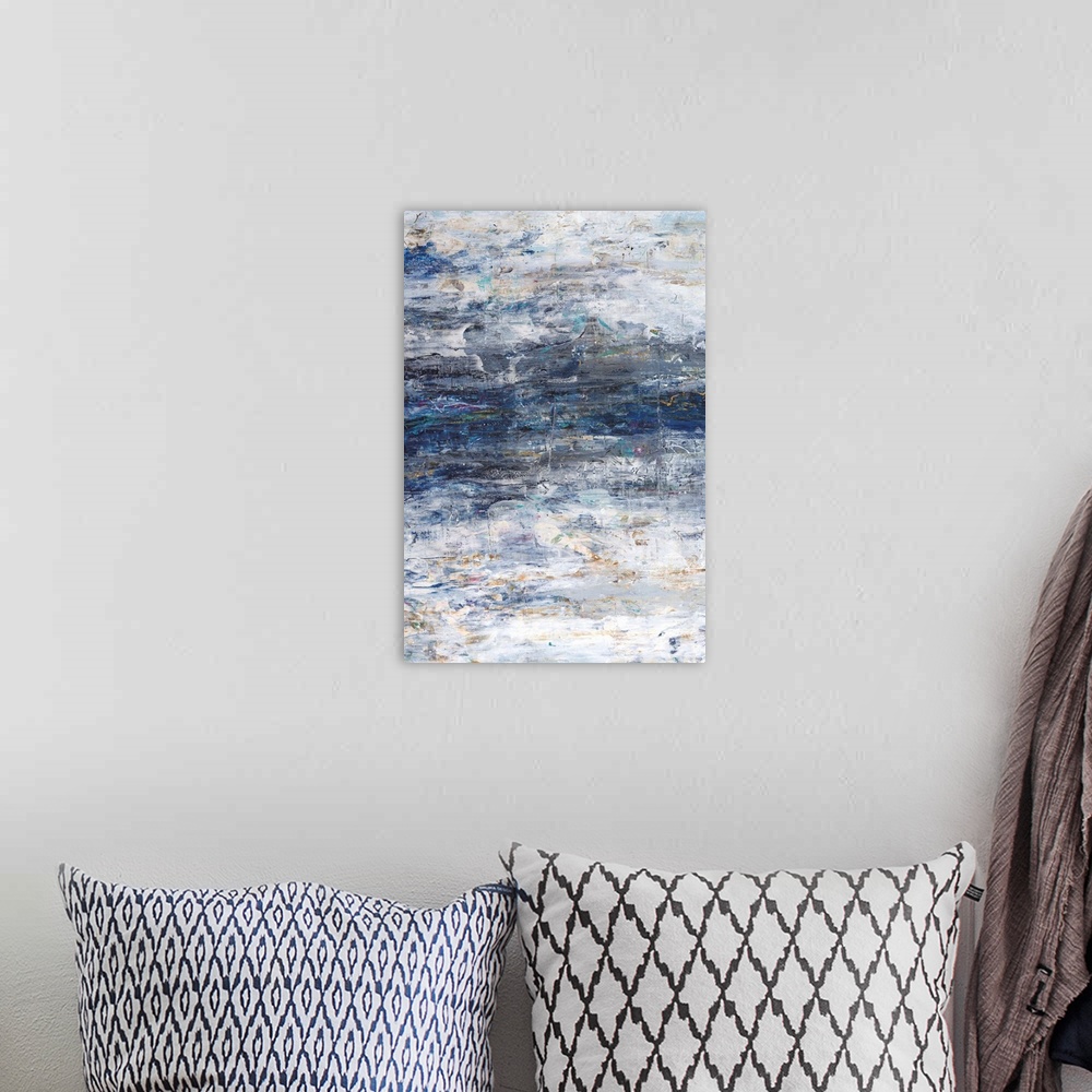 A bohemian room featuring Vertical abstract painting in textured colors of blue, white, brown and gray.