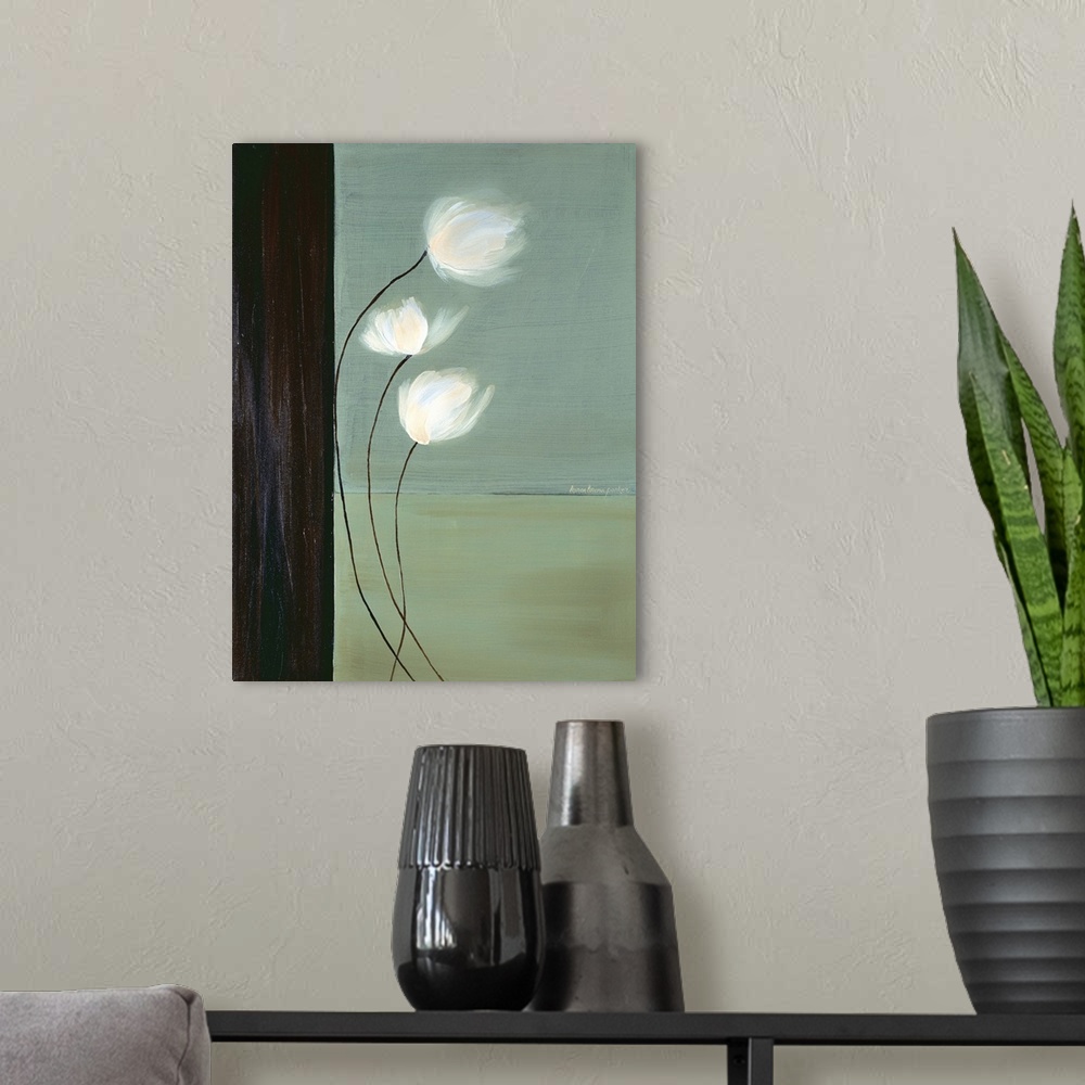 A modern room featuring Vertical painting of three white flowers with long stems against a teal background with a black b...