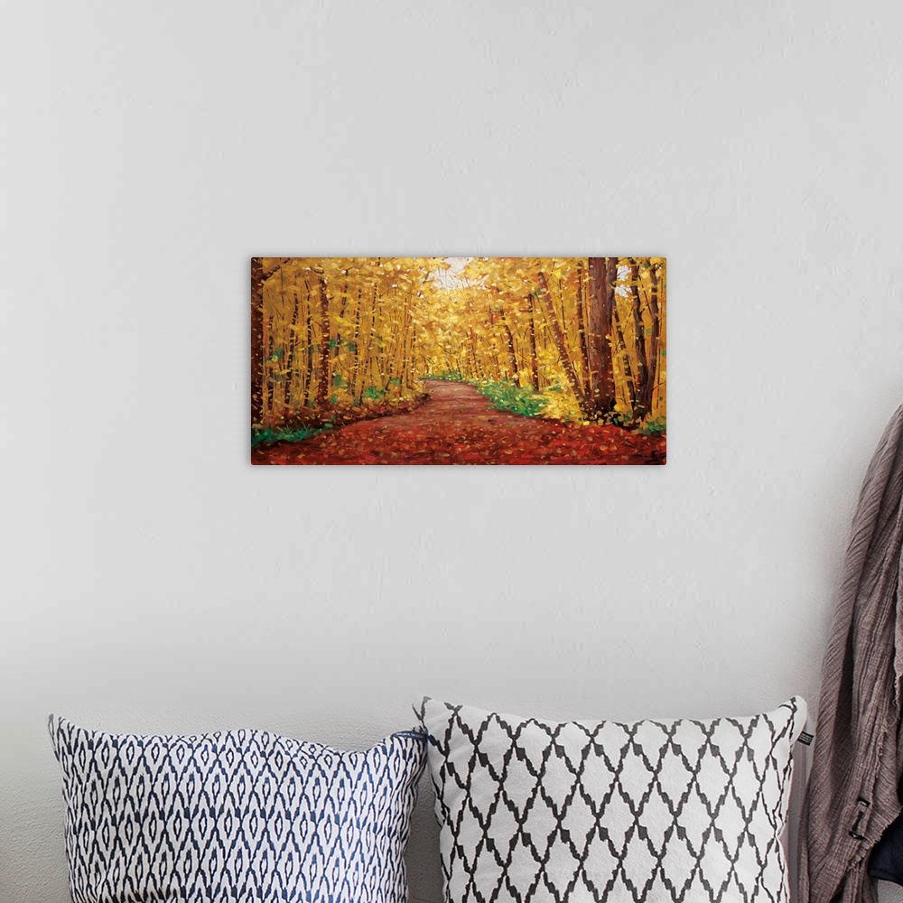 A bohemian room featuring Long horizontal painting of a country road cutting through a forest in the fall, with warm, golde...