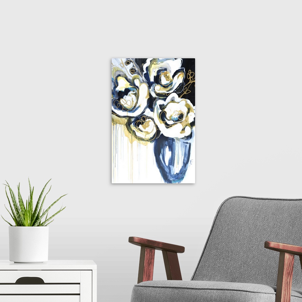 A modern room featuring A modern abstract floral of large white blooms with gold outlined accents in a blue vase.