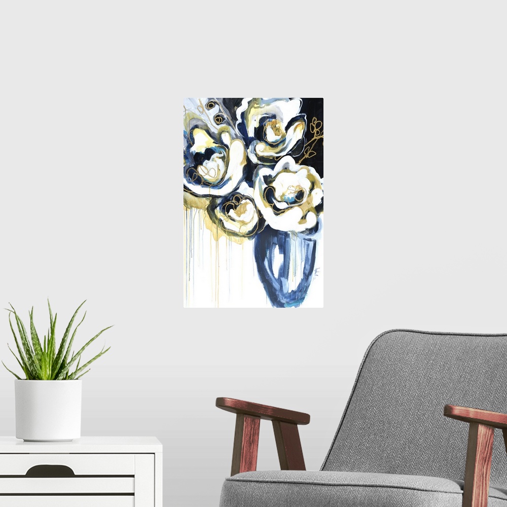 A modern room featuring A modern abstract floral of large white blooms with gold outlined accents in a blue vase.