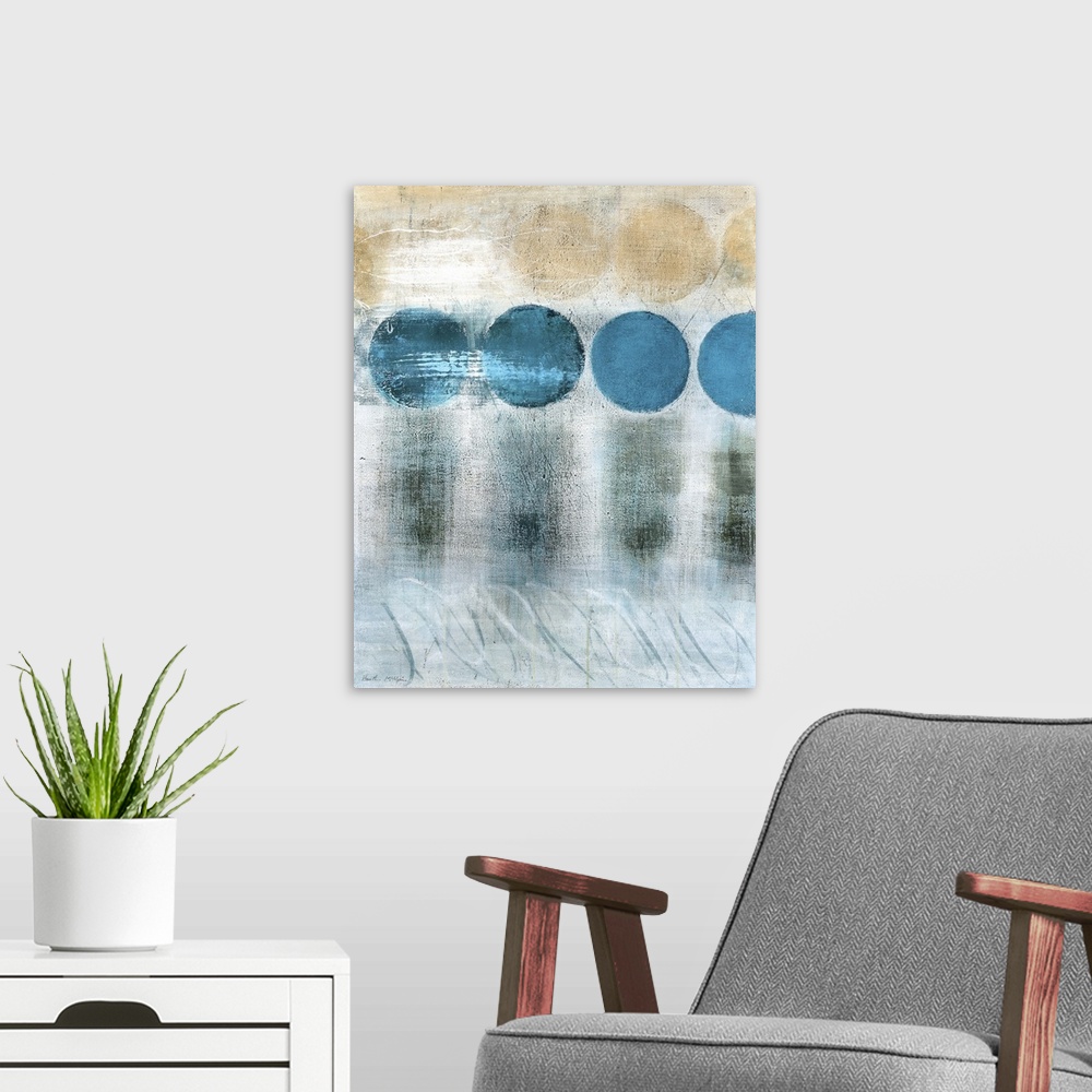 A modern room featuring A vertical abstract painting in blue and brown tones with circles and textured strokes.