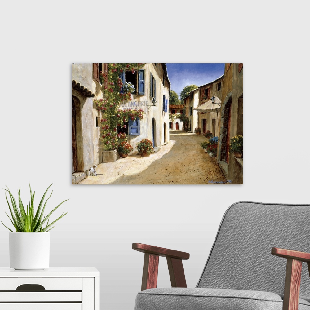 A modern room featuring Painting of a quiet alleyway in a European village.