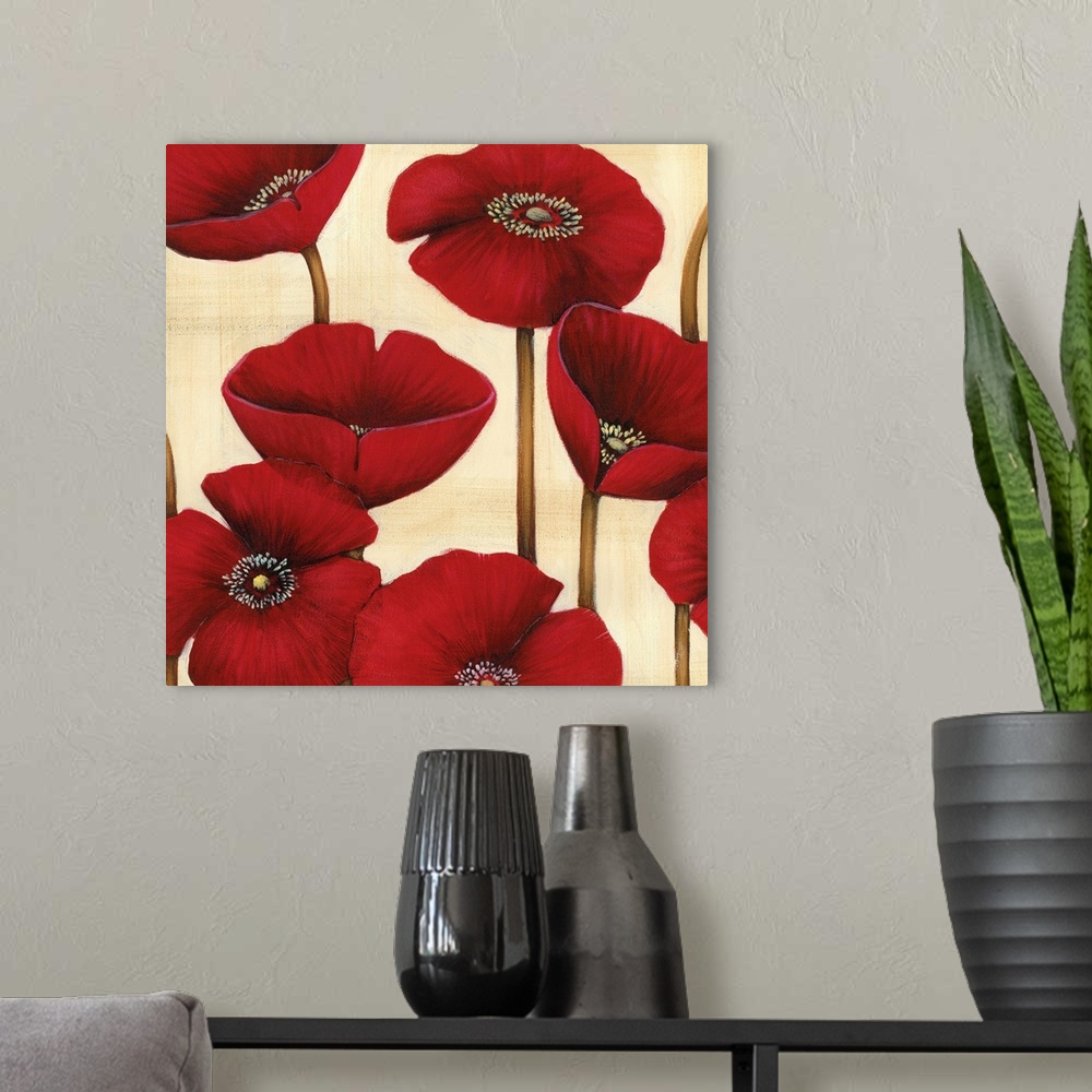A modern room featuring Square contemporary artwork of red poppy flowers against a neutral backdrop.