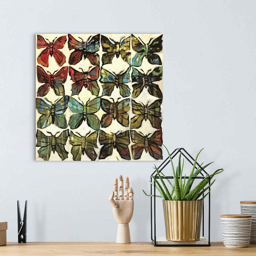 A bohemian room featuring Square complementary painting of rows of butterflies in multiple colors fading into each other.