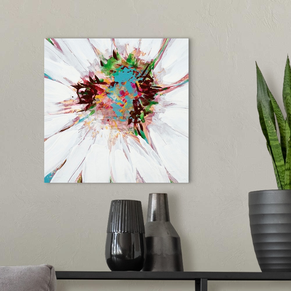 A modern room featuring A square painting of close up center of a daisy in multiple colors.