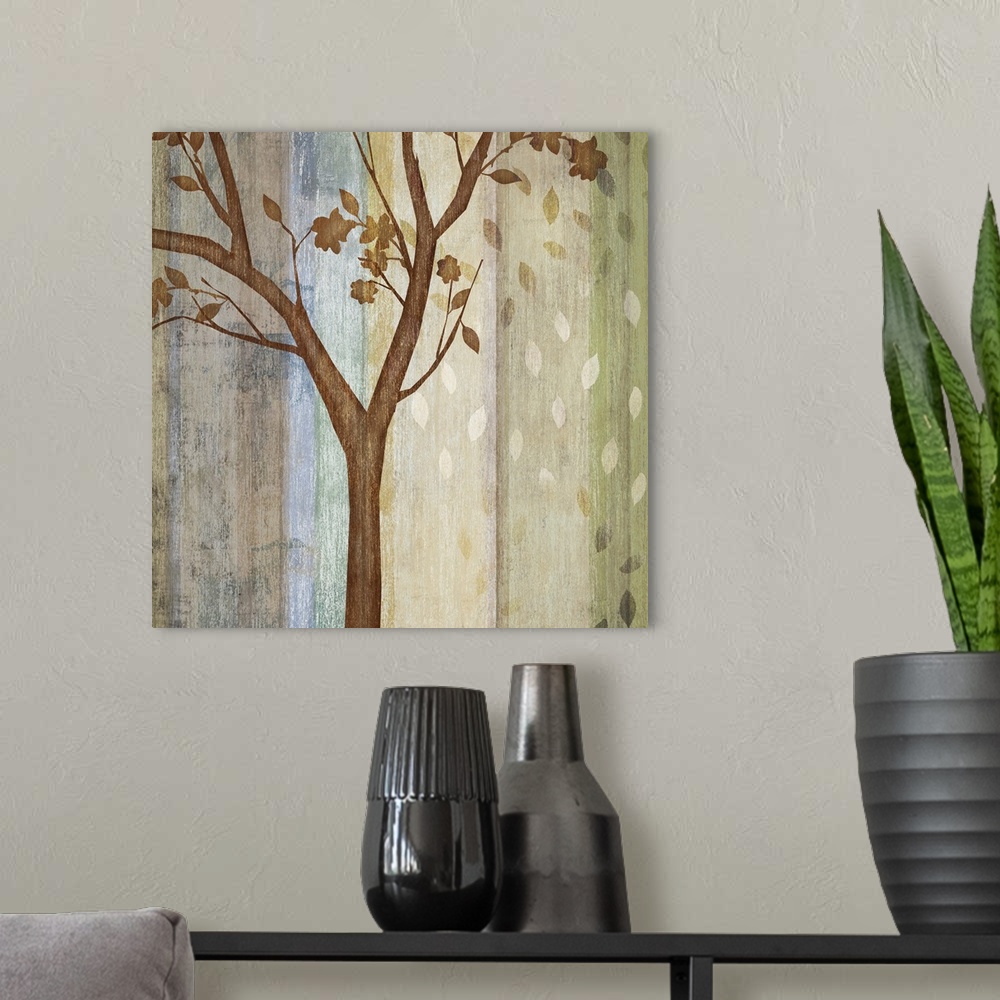 A modern room featuring Decorative artwork of a single tree with falling leaves and a color striped background in neutral...