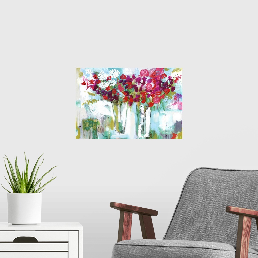 A modern room featuring A horizontal abstract floral painting of red roses and white flowers in two vases on a textured b...