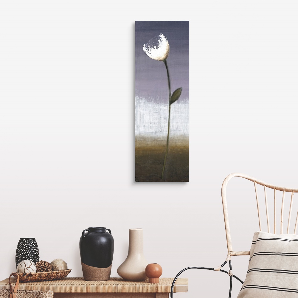 A farmhouse room featuring A long vertical painting of a single white flower on a long stem with a textured neutral background.