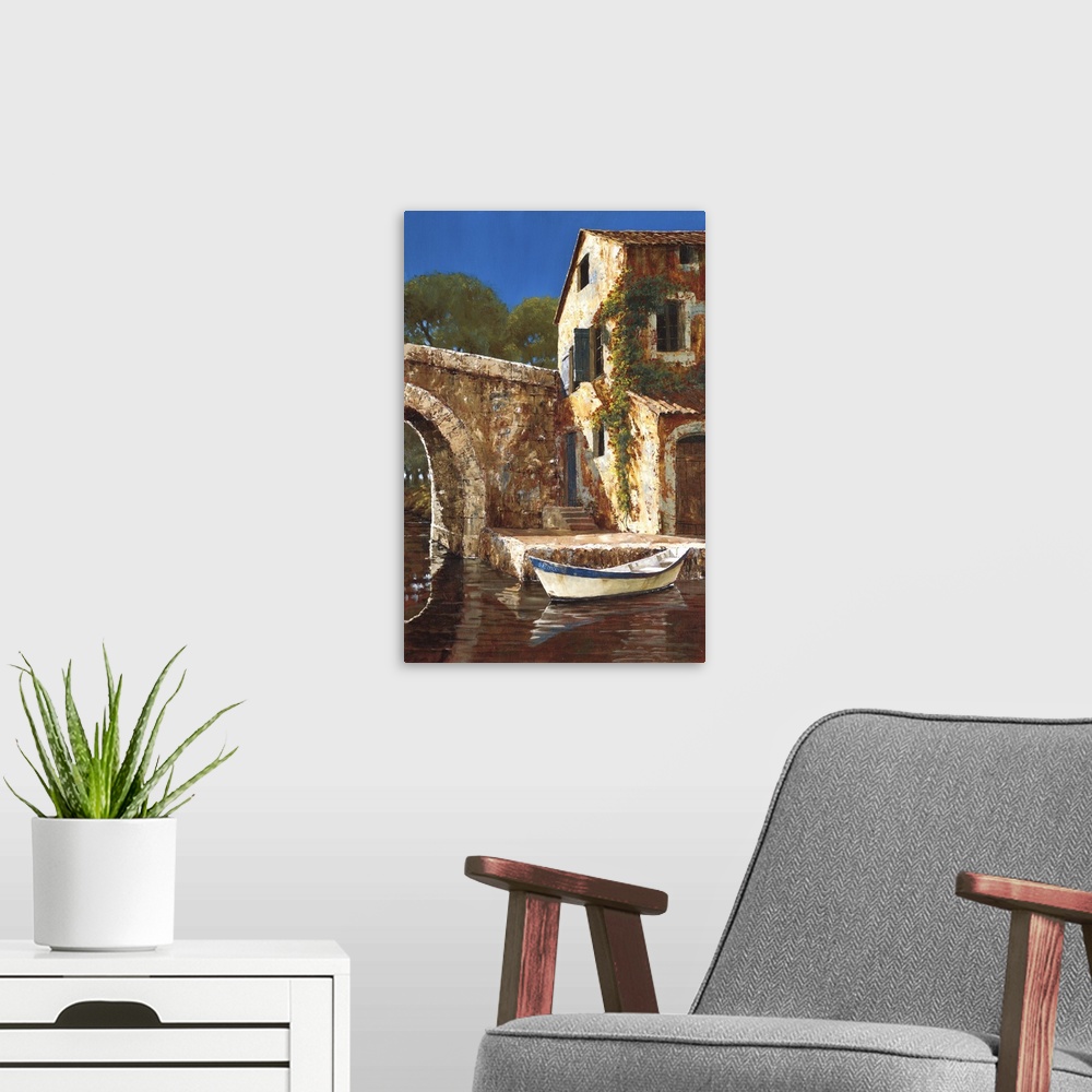 A modern room featuring Painting of a small boat docked by a stone house with vines in Europe.