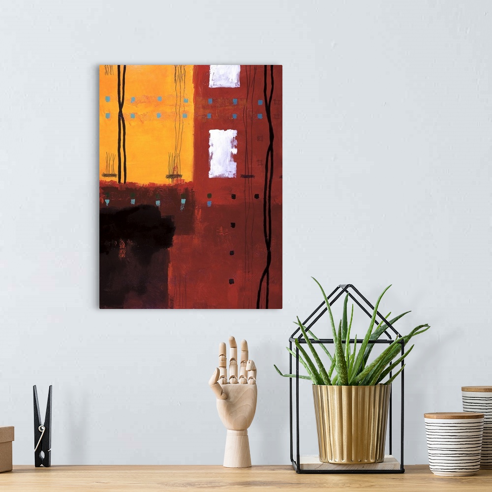 A bohemian room featuring Vertical abstract of red and yellow with small boxes in horizontal rows and croaked vertical line...