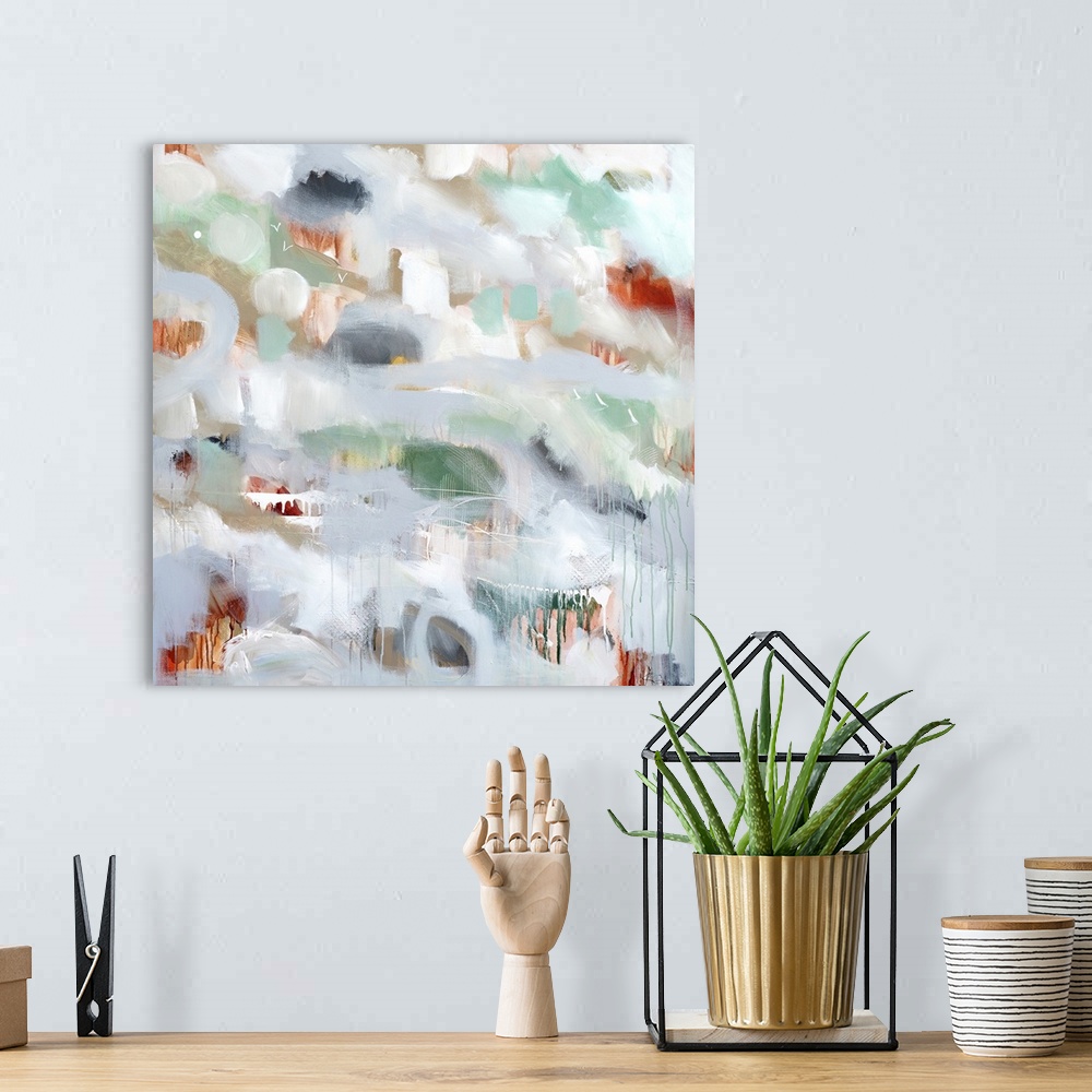 A bohemian room featuring Square abstract painting of spots of color peeping through light gray with small drips of paint a...