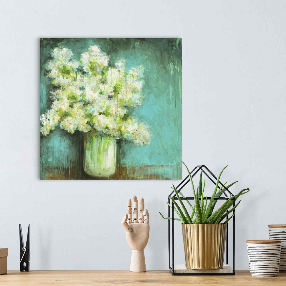 A bohemian room featuring Square painting of a large vase full of hydrangeas in white and green done in streaks and texture...