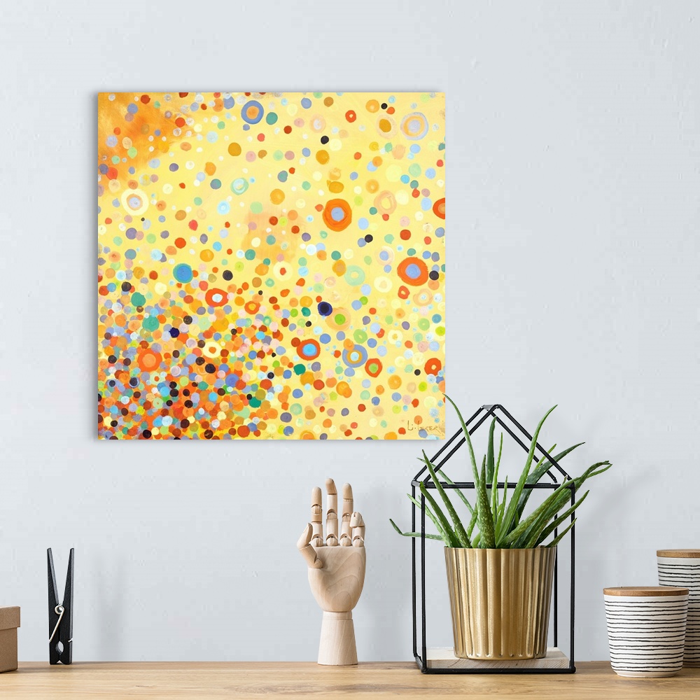 A bohemian room featuring Square contemporary painting of multi-colored circles in bright colors with a yellow background.