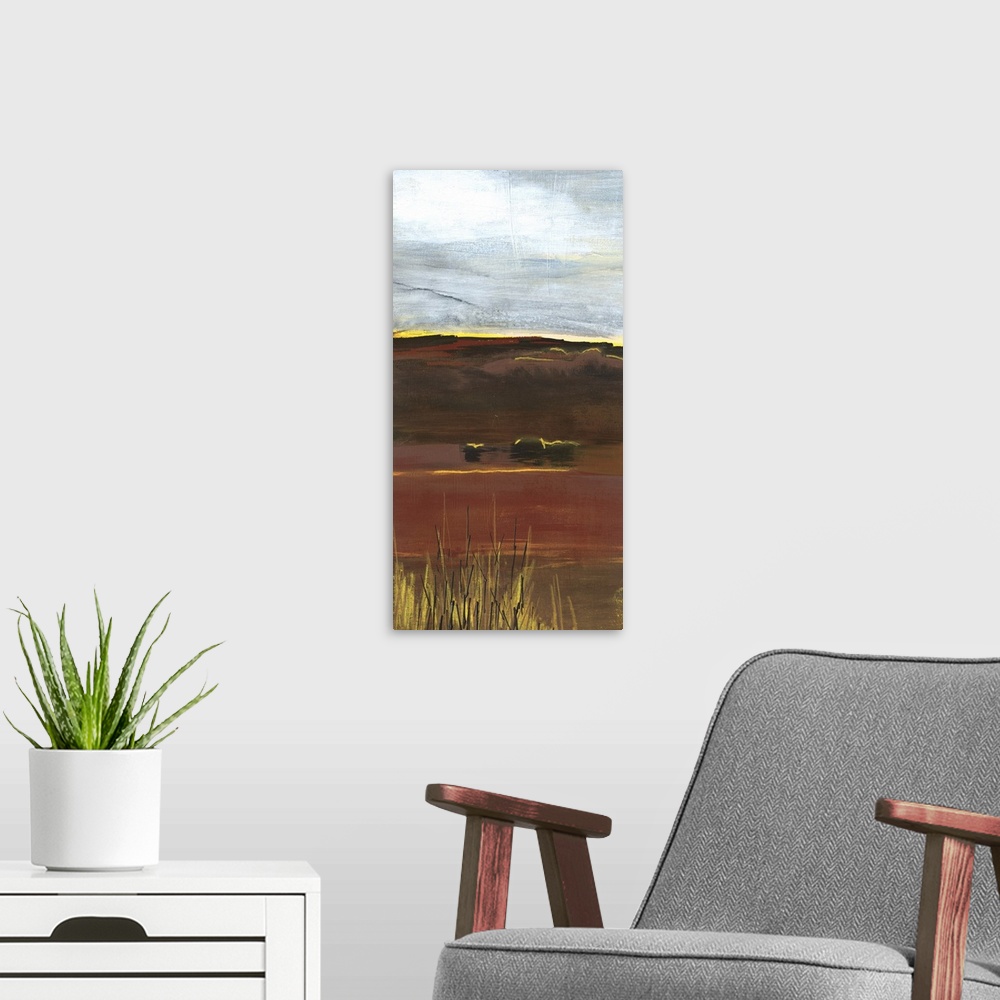 A modern room featuring A long vertical painting of an abstract landscape of a prairie field in textured earth tones.