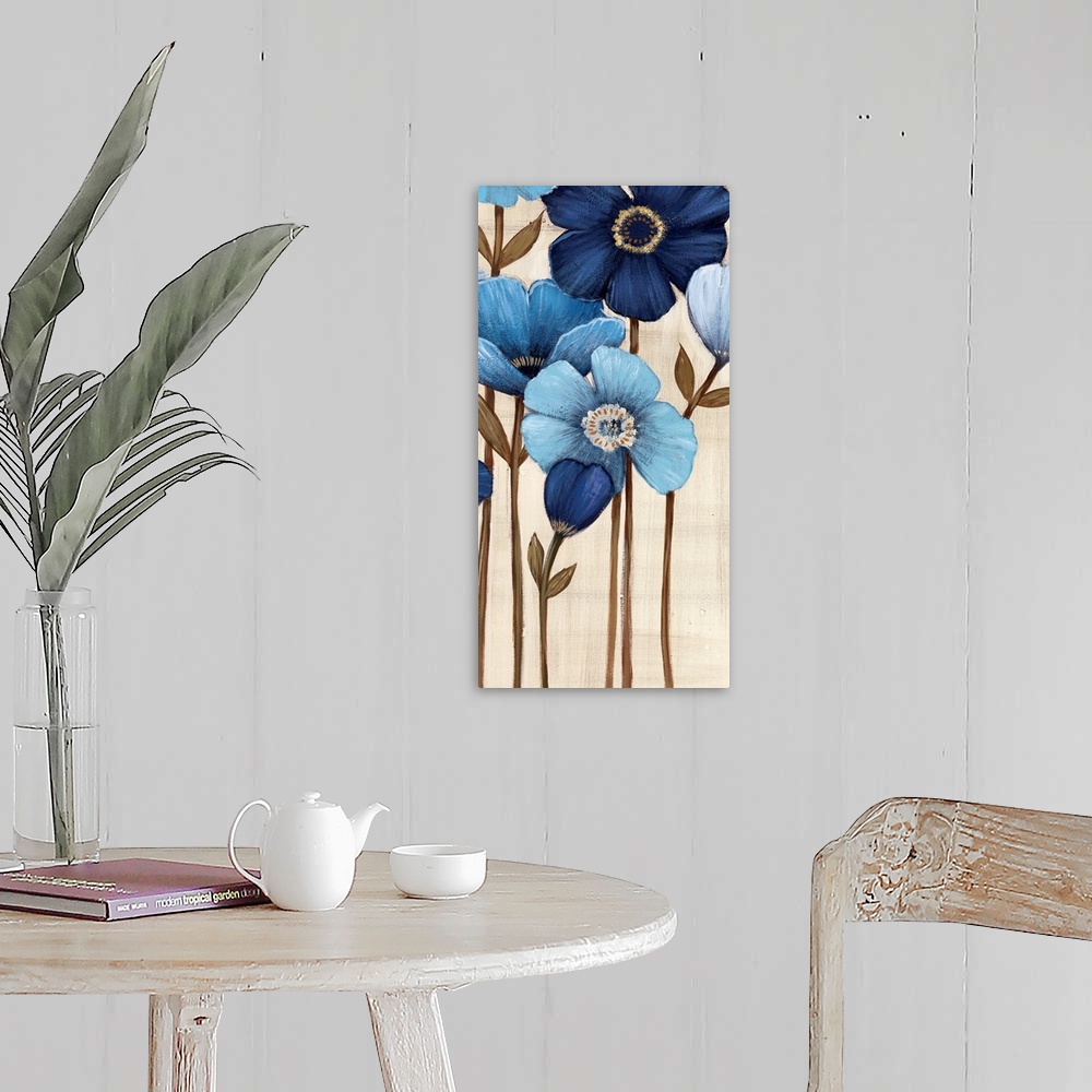 A farmhouse room featuring Vertical painting of a group of blue flowers against a neutral backdrop.
