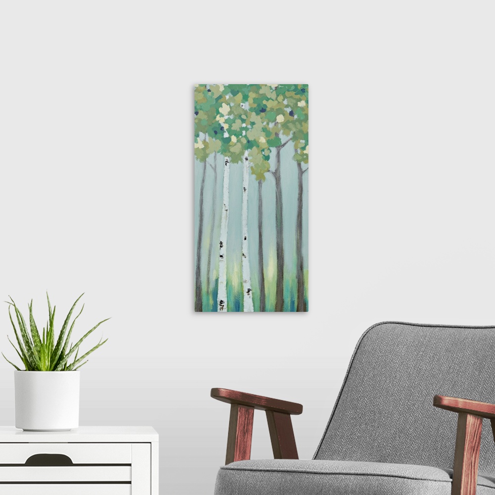 A modern room featuring A long vertical painting of a row of trees in muted cool tones.