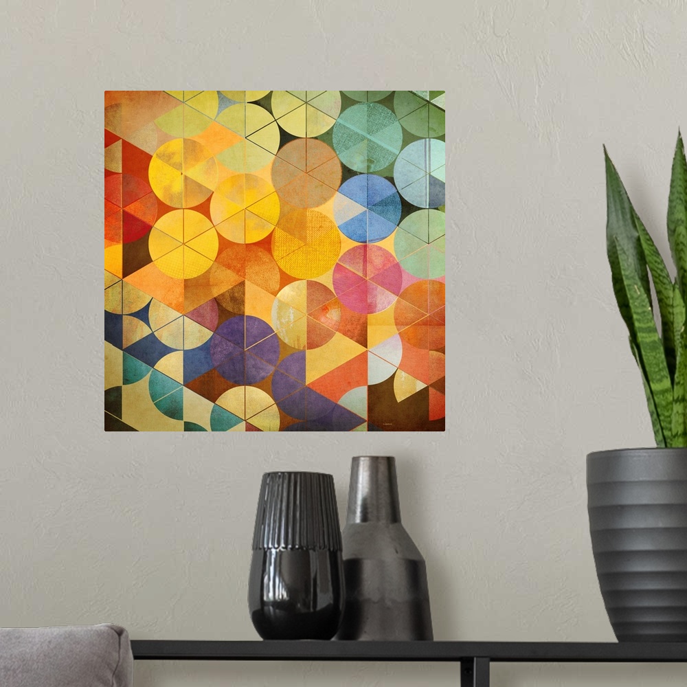 A modern room featuring A square abstract of rows of circles with triangle overlays in multiple bright colors.