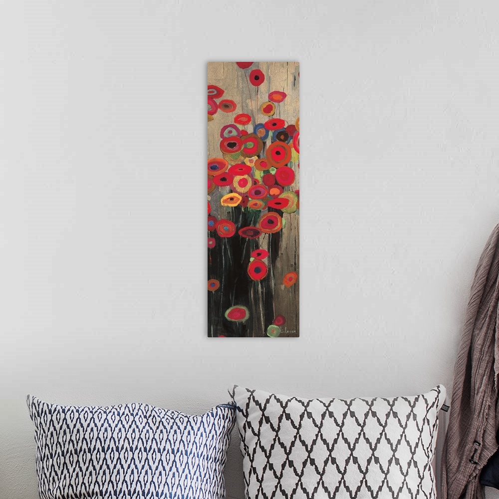 A bohemian room featuring A long vertical painting of a group of multi-colored poppies on a neutral backdrop.