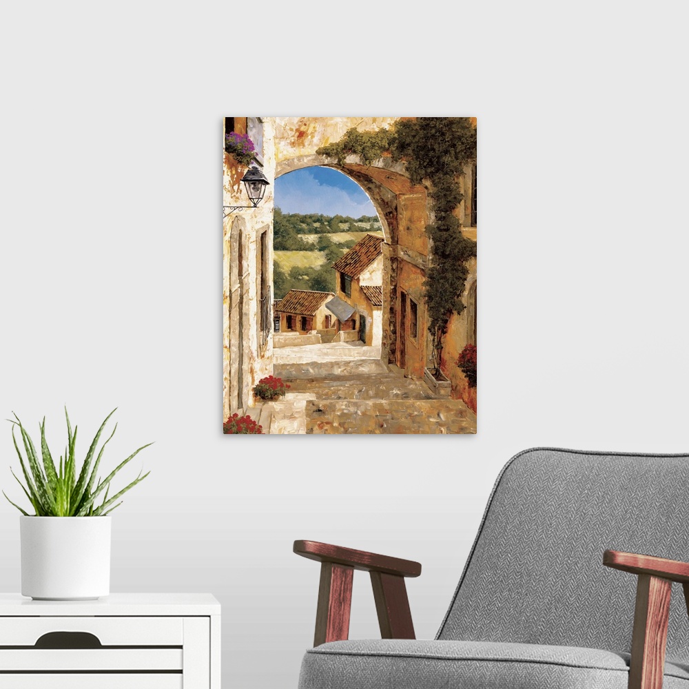 A modern room featuring Contemporary artwork of an alley in a rural European village.