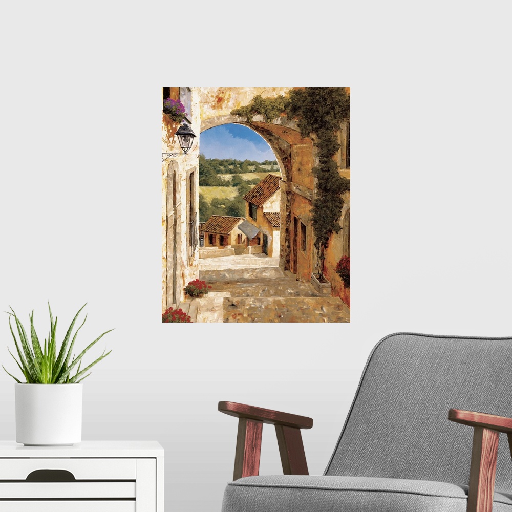A modern room featuring Contemporary artwork of an alley in a rural European village.