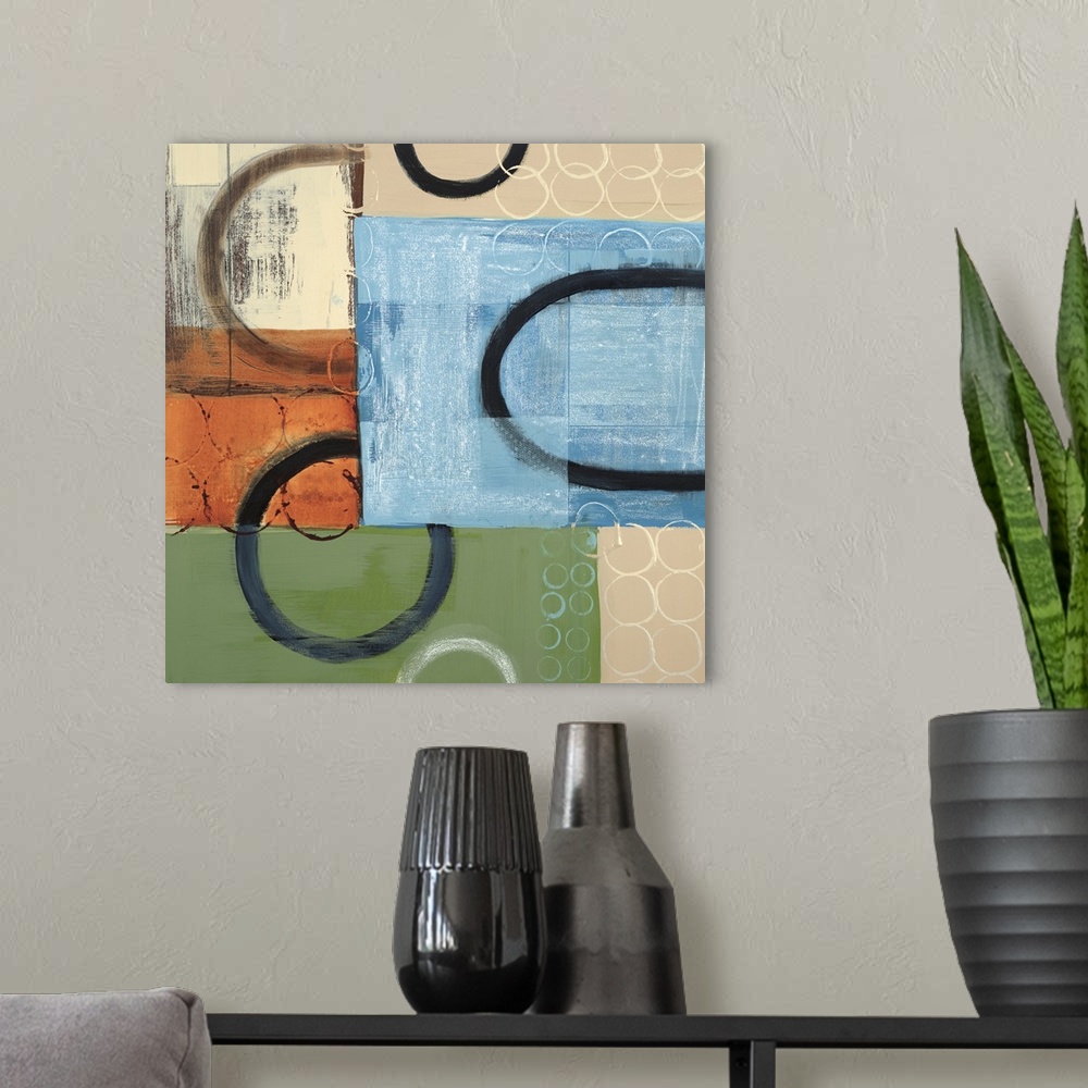 A modern room featuring Abstract painting of multi-colored squared shapes with circular elements in black and white overl...