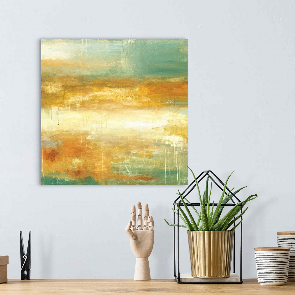 A bohemian room featuring Square abstract painting in textured colors of green, gold and cream.