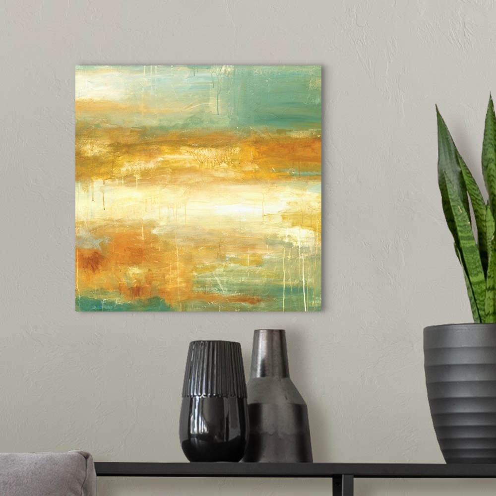 A modern room featuring Square abstract painting in textured colors of green, gold and cream.