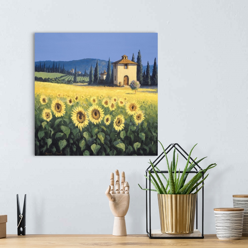 A bohemian room featuring Painting of a field of sunflowers near a farm house in Tuscany.