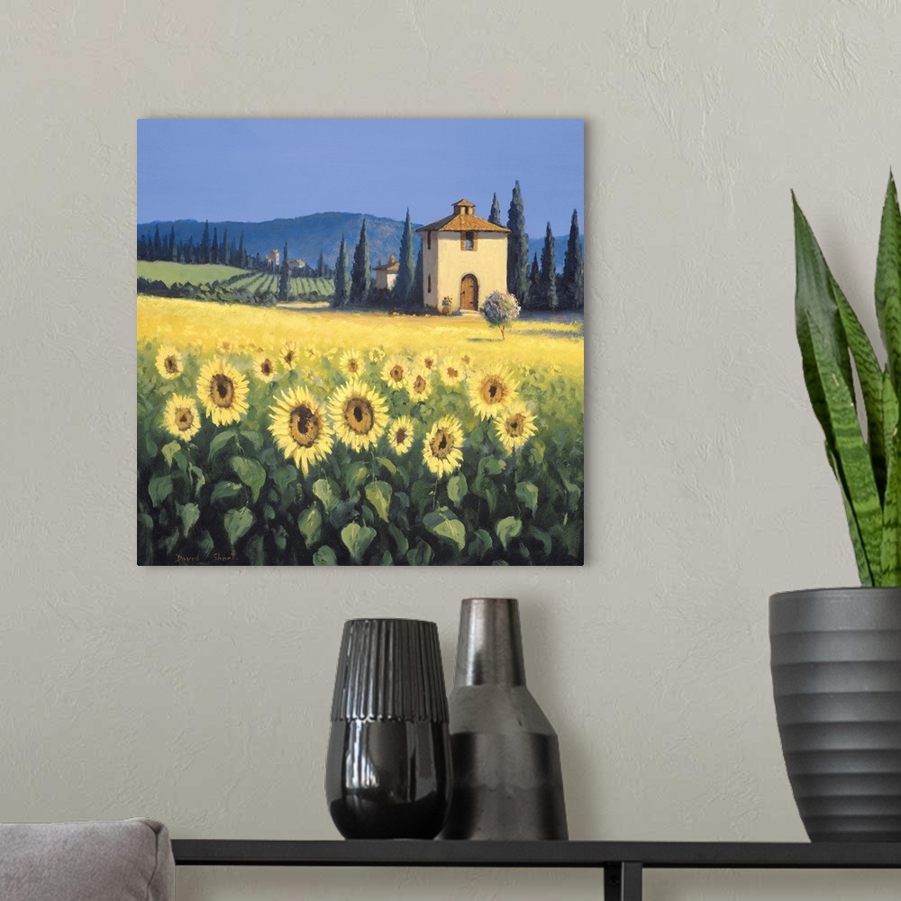 A modern room featuring Painting of a field of sunflowers near a farm house in Tuscany.