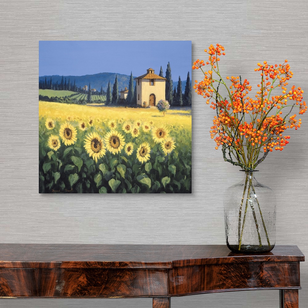 A traditional room featuring Painting of a field of sunflowers near a farm house in Tuscany.