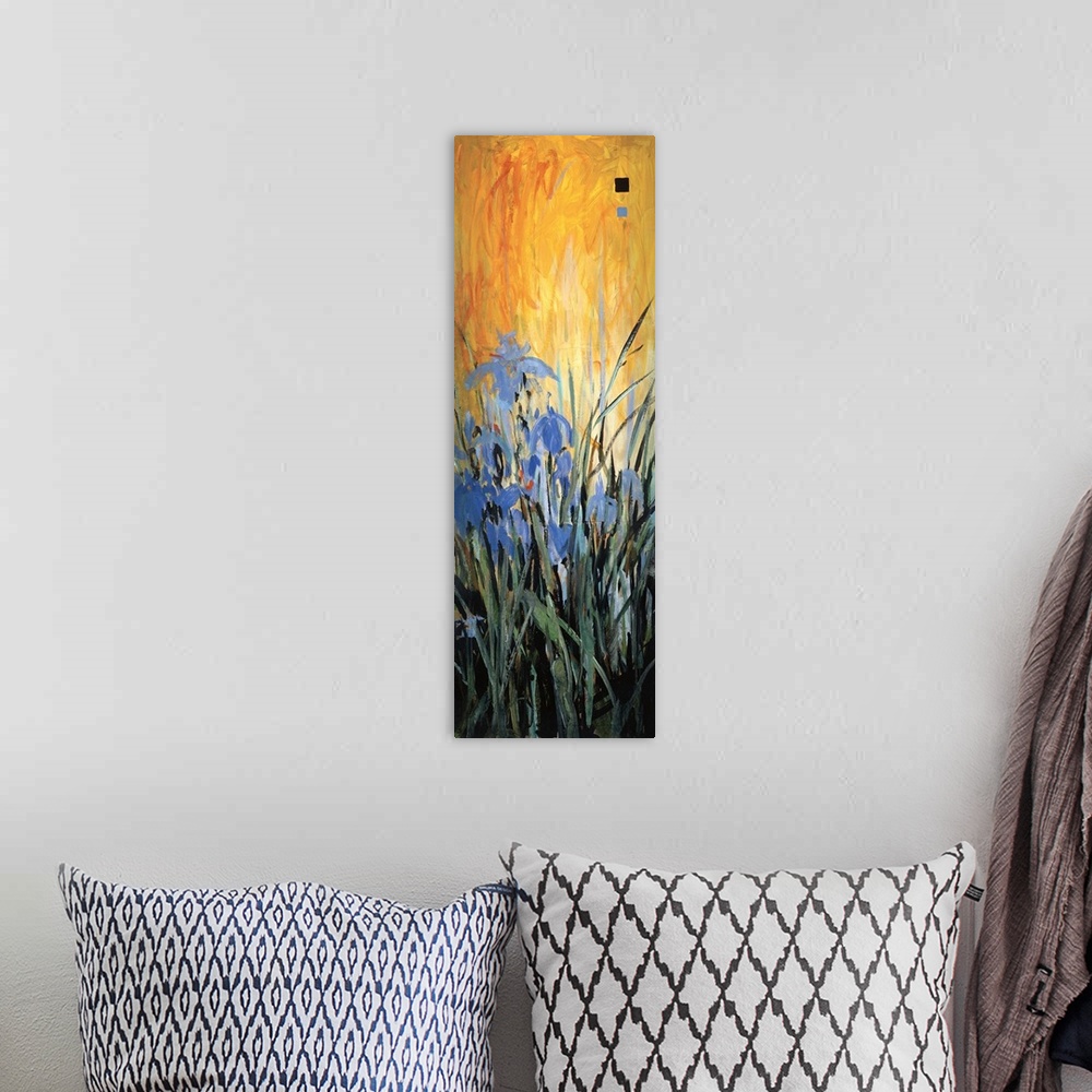 A bohemian room featuring A contemporary painting with blue flowers with long grass and a bright orange background.