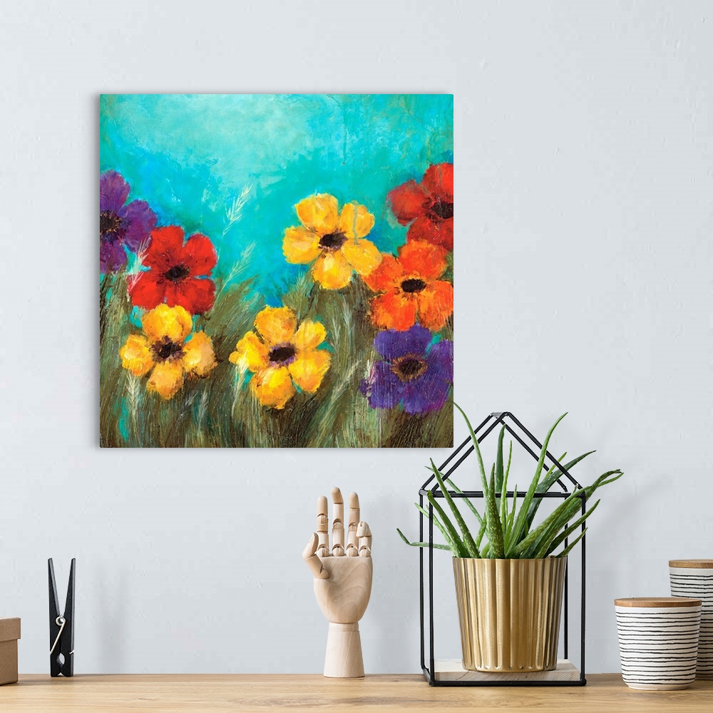 A bohemian room featuring Square contemporary painting of bright, colorful flowers against a teal background.