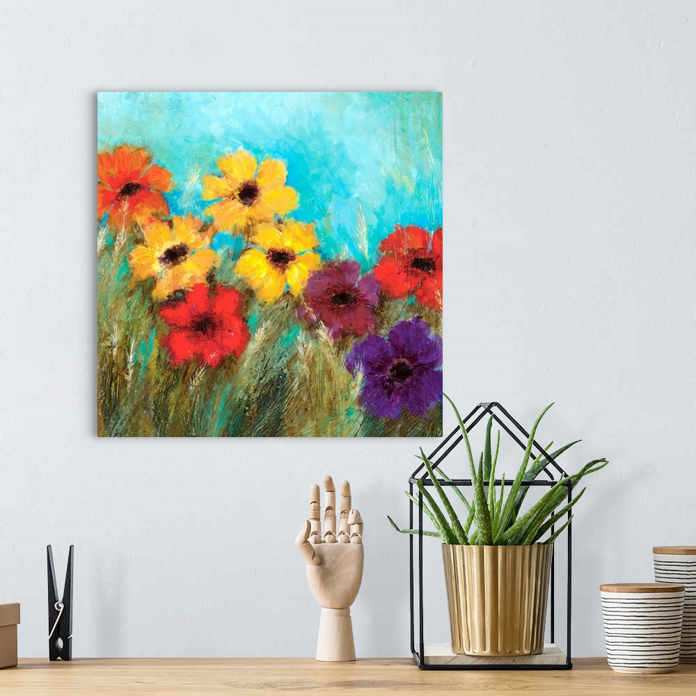 A bohemian room featuring Square contemporary painting of bright, colorful flowers against a teal background.