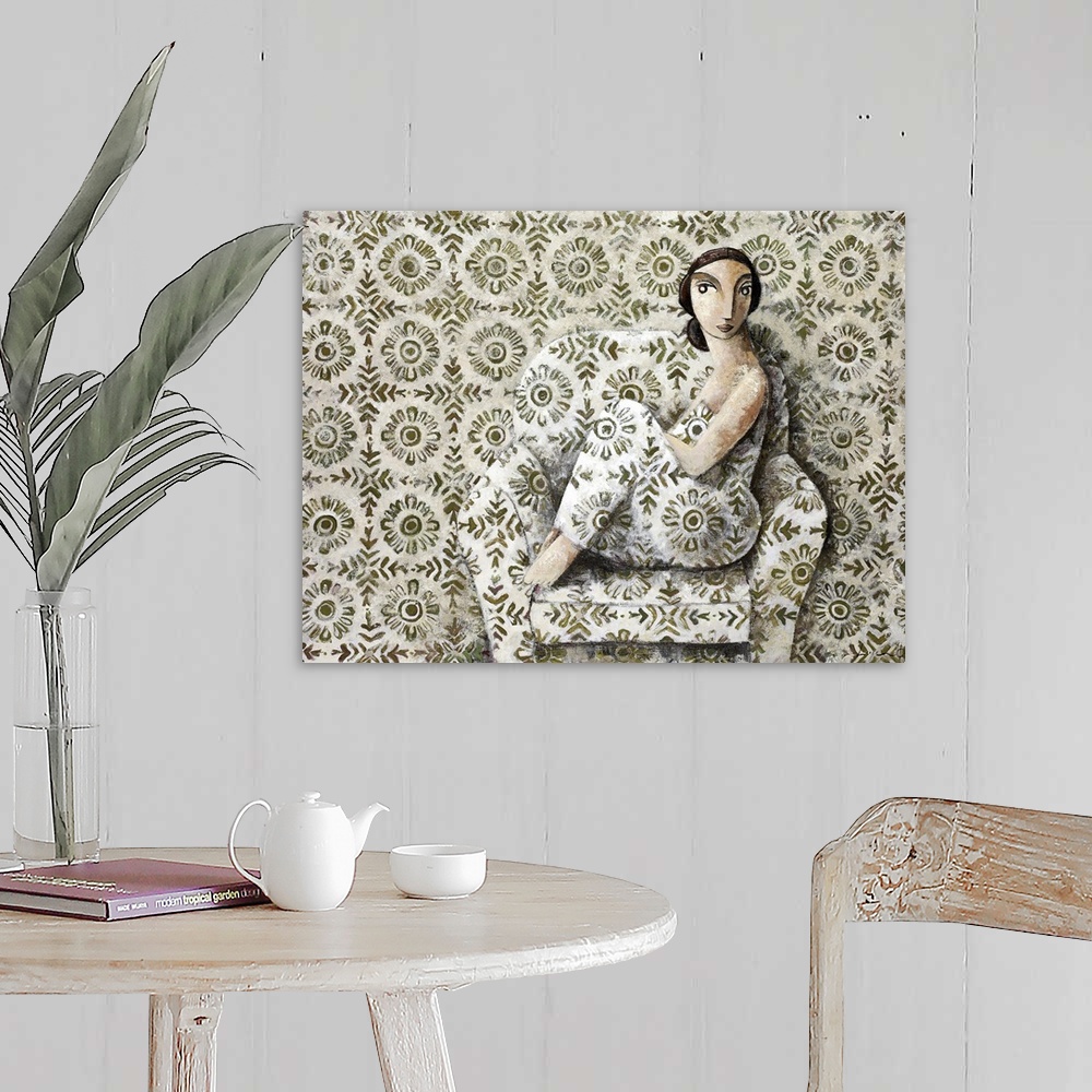 A farmhouse room featuring A portrait of a woman sitting on a plush chair with a repetitive floral pattern on the chair, clo...