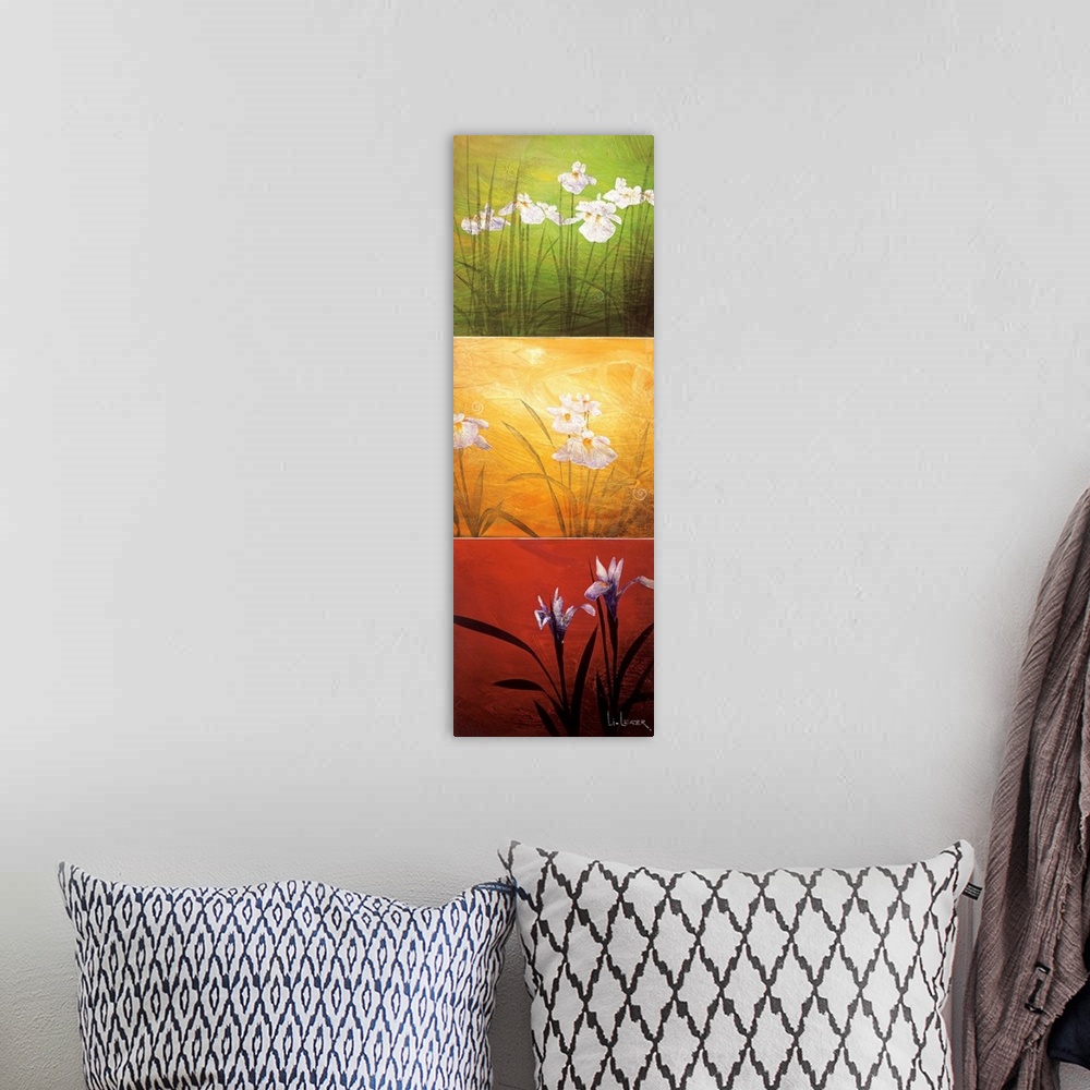 A bohemian room featuring A long vertical painting of flowers in three panels of red, green and yellow.