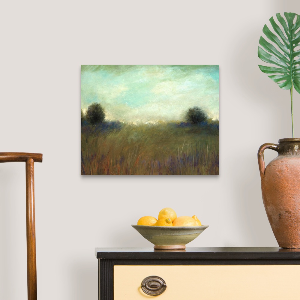 A traditional room featuring A muted contemporary painting of tall grass in a field with a line of trees in the background.