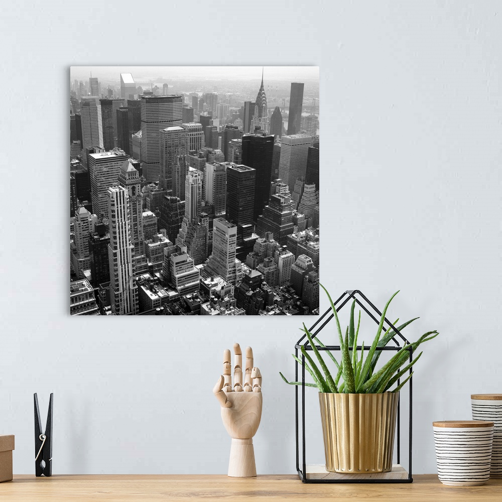 A bohemian room featuring Black and white photo of New York.