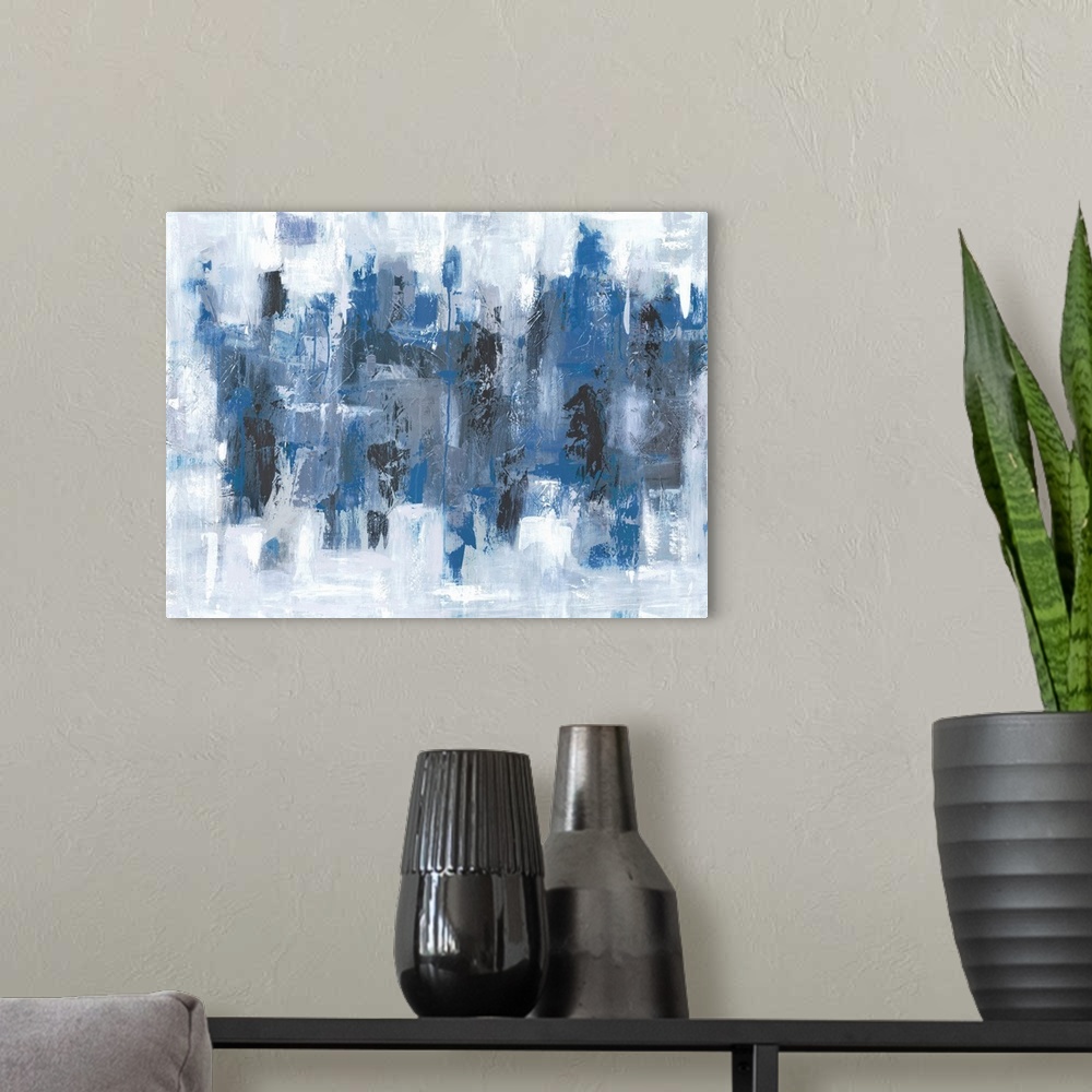 A modern room featuring Abstract painting in textured colors of blue, black, white and gray.