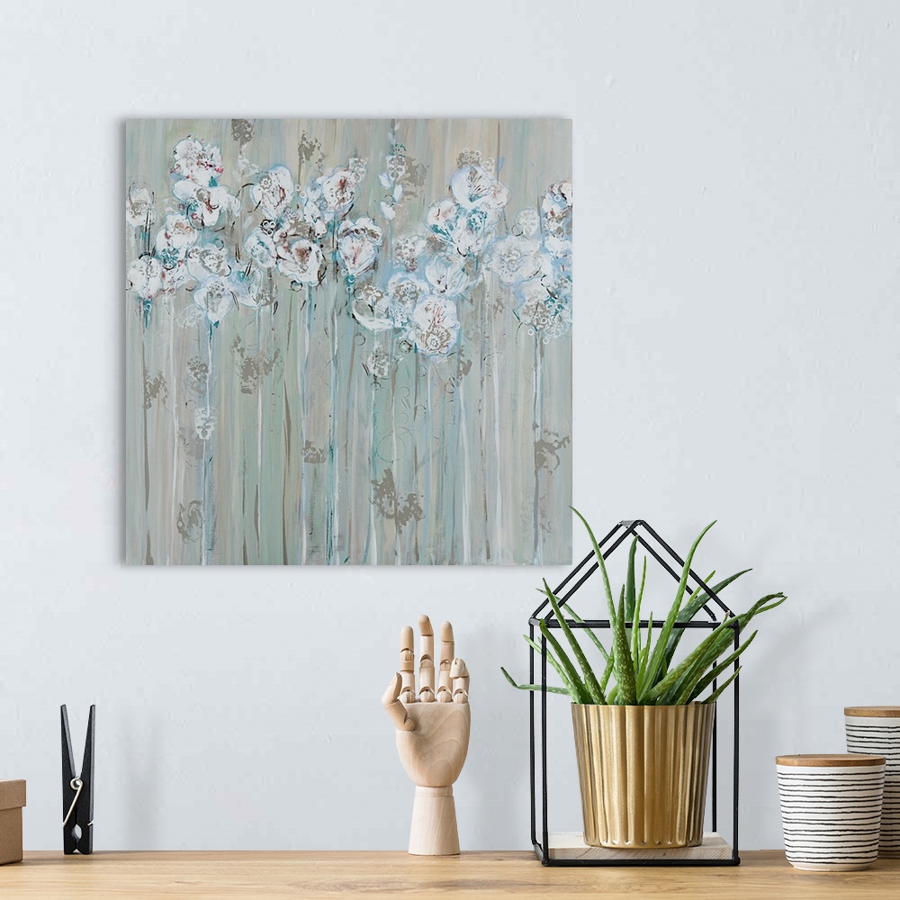 A bohemian room featuring Square contemporary floral painting in muted colors of gray, white and blue.