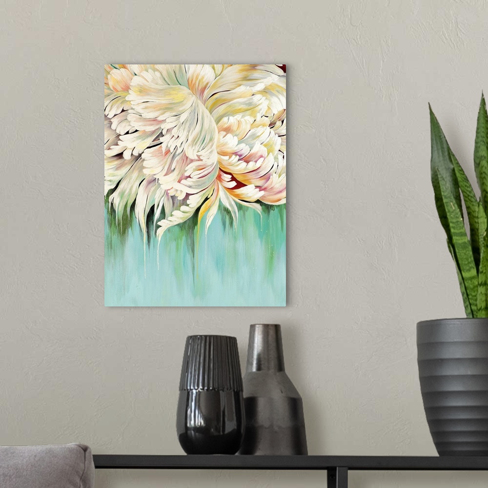 A modern room featuring A complementary painting of a large white blooming flower, with hints of yellow and red.
