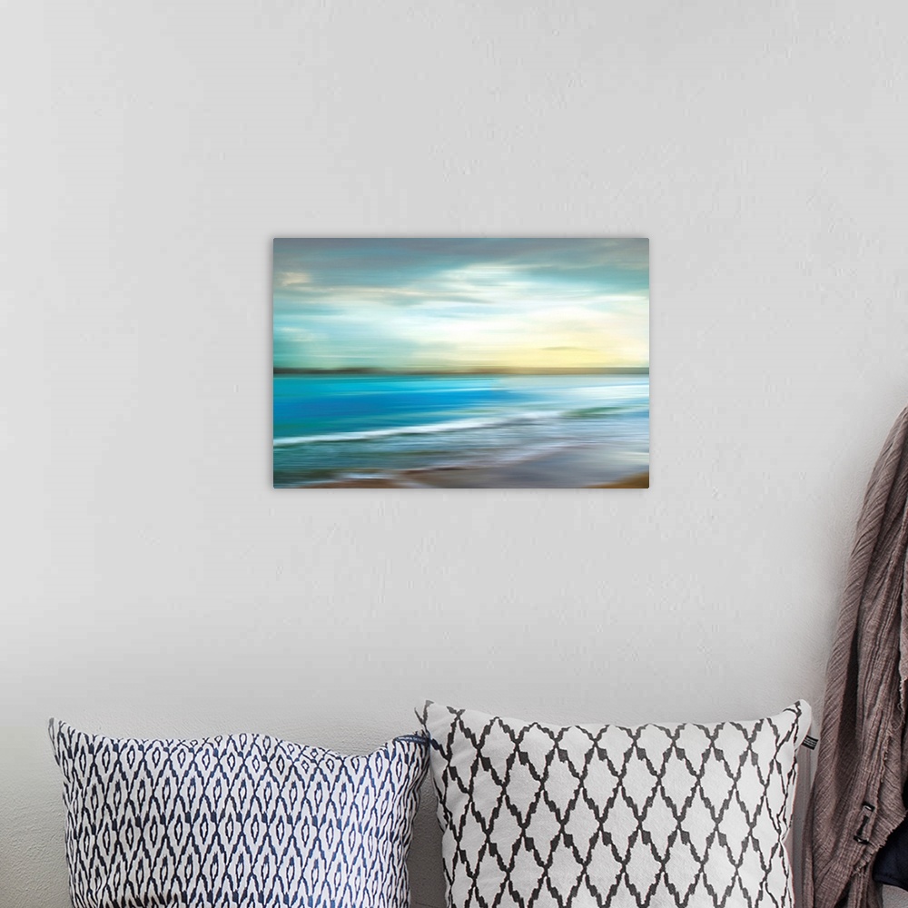 A bohemian room featuring A seascape photograph of ocean waves in a blurred effect that gives the image a sense of motion.