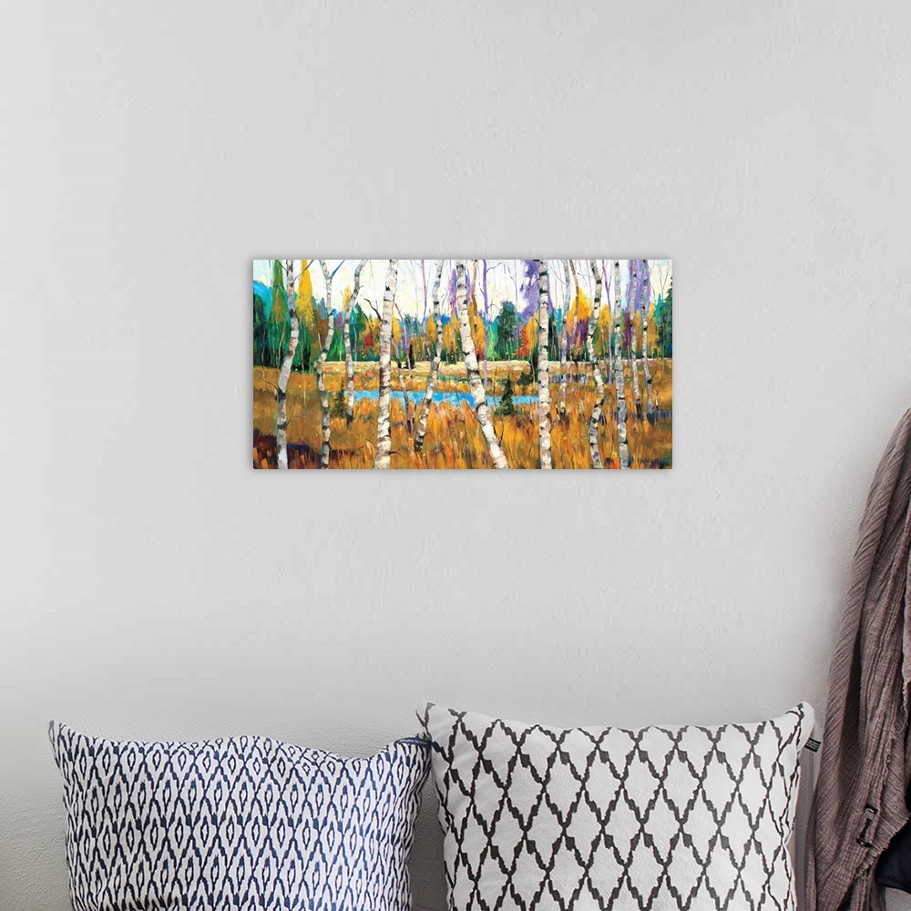 A bohemian room featuring Contemporary painting of a forest full of colorful trees with a small pond.