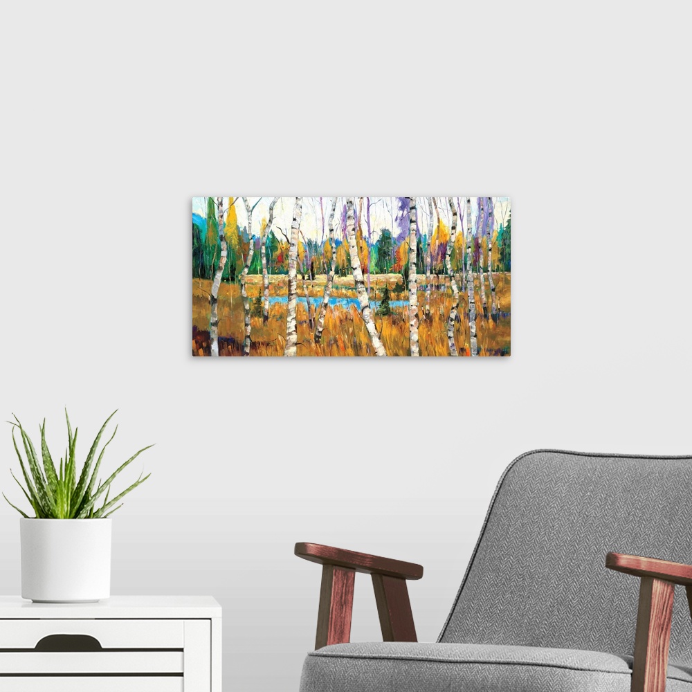 A modern room featuring Contemporary painting of a forest full of colorful trees with a small pond.