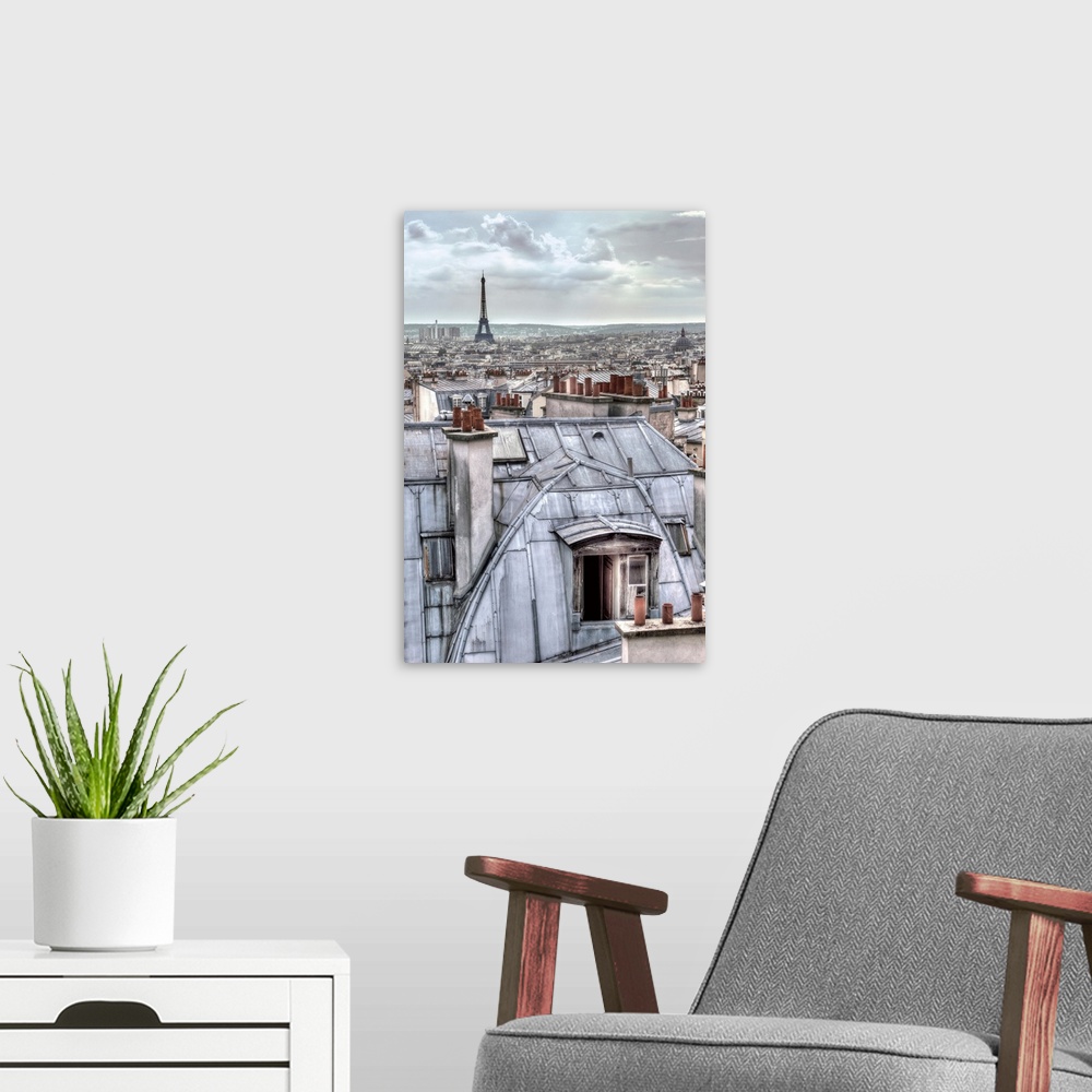 A modern room featuring Photograph of the roof tops of Paris, France with the Eiffel Tower in the distance.