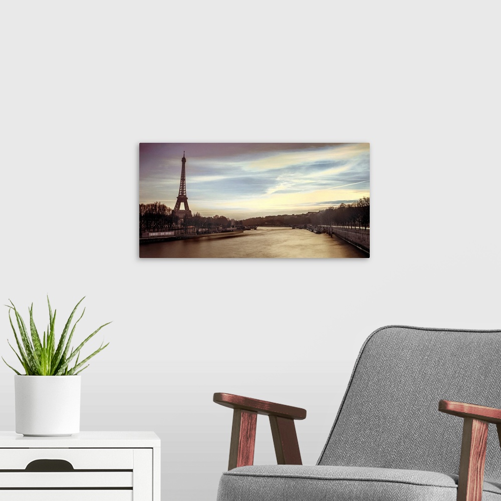 A modern room featuring Panoramic image of Paris with the Eiffel tower and Seine River in the evening.