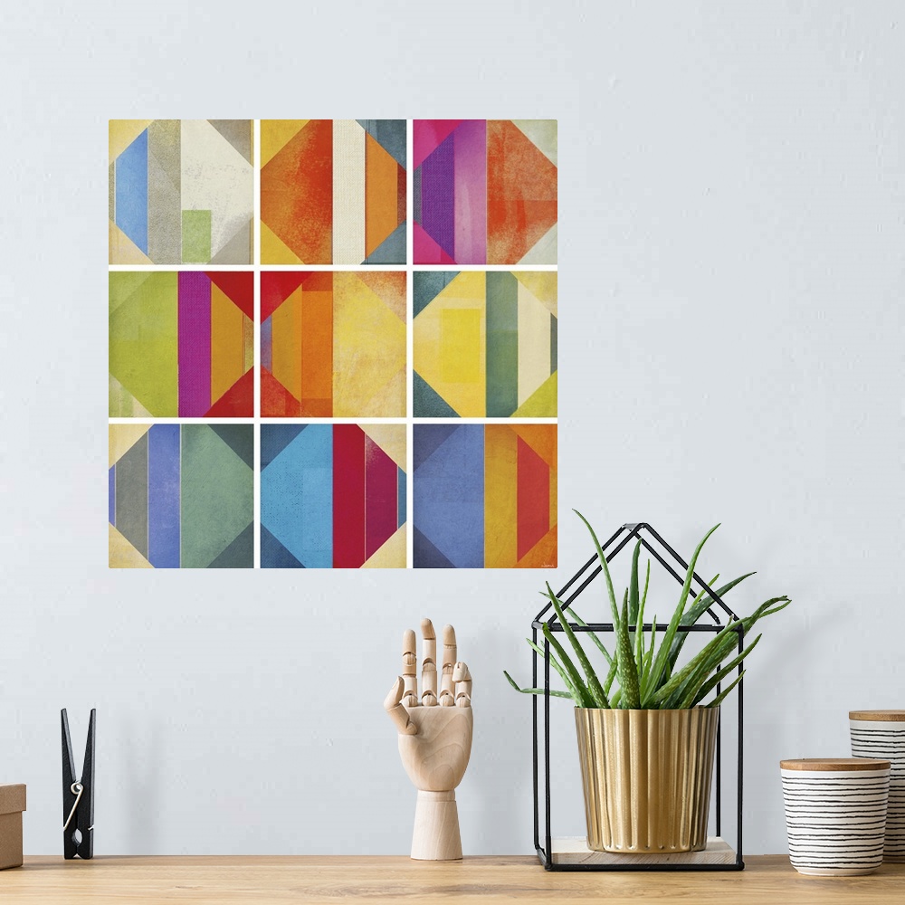 A bohemian room featuring A square abstract of rows of multi-colored diamond shapes within boxes divided by white lines.