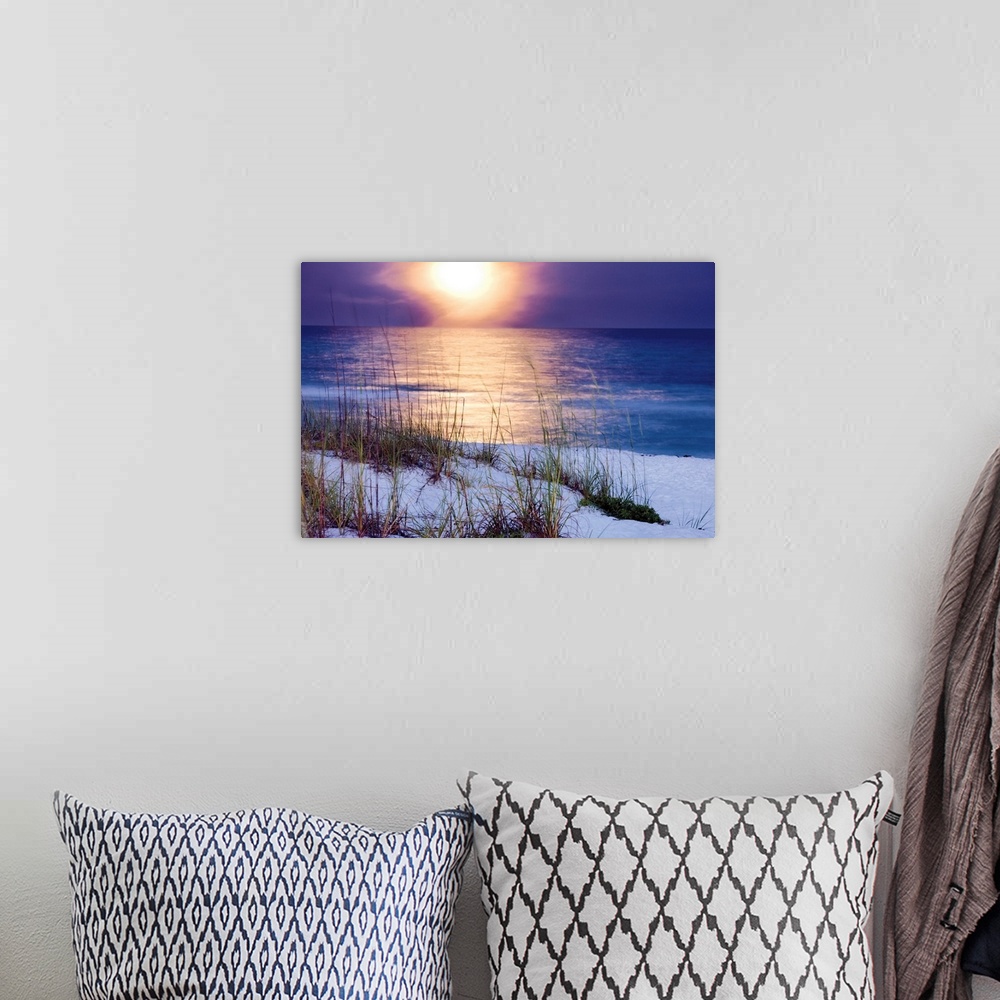 A bohemian room featuring Photograph of the raising moon over the ocean shore and dunes.